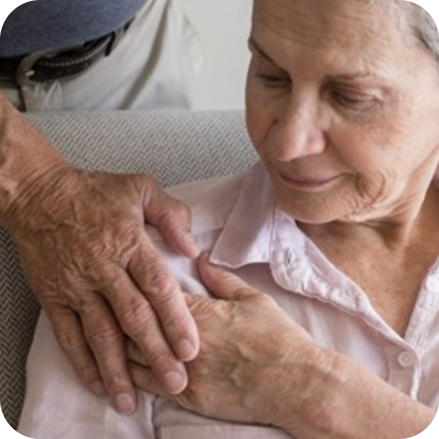 A person resting there hand on another persons shoulder